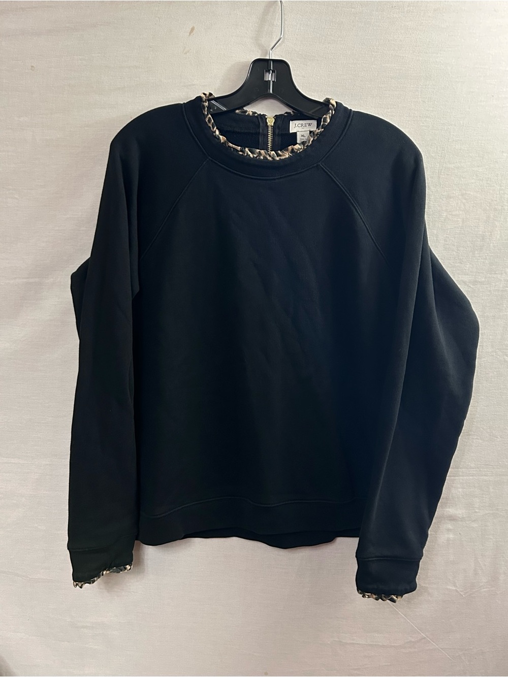 J Crew black sweatshirt w/ leopard print ruffled trim at the neckline and cuffs